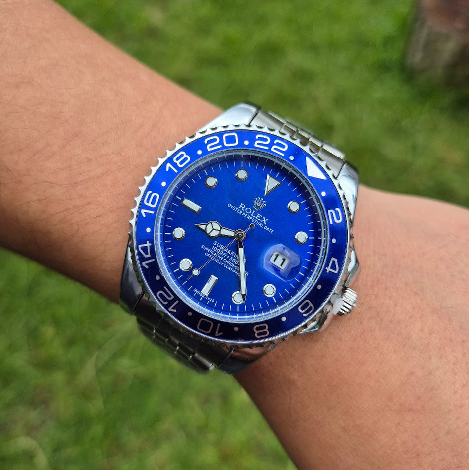 Rolex Oyster Perpetual Date plateado pantalla azul bisel azul